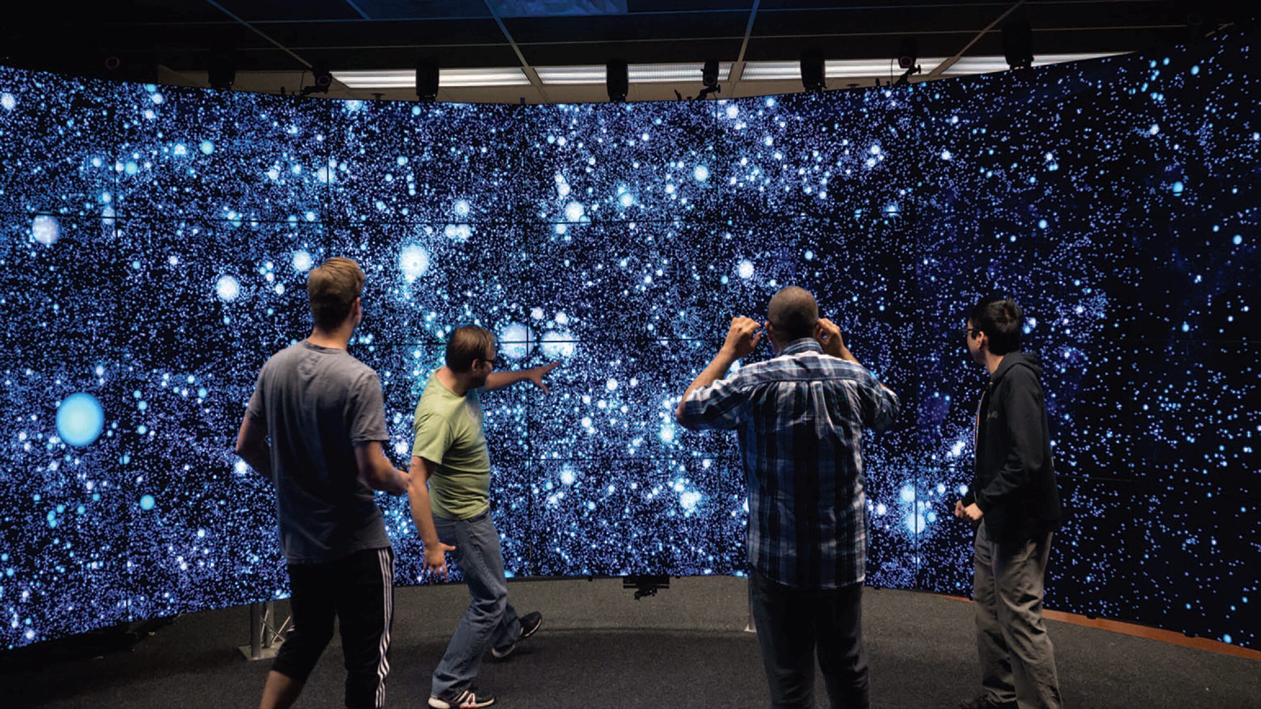 Cavern Halos: Exploring Spatial and Nonspatial Cosmological Data in an Immersive Virtual Environment